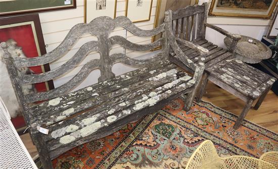 A weathered teak six piece garden furniture set Benches 150cm